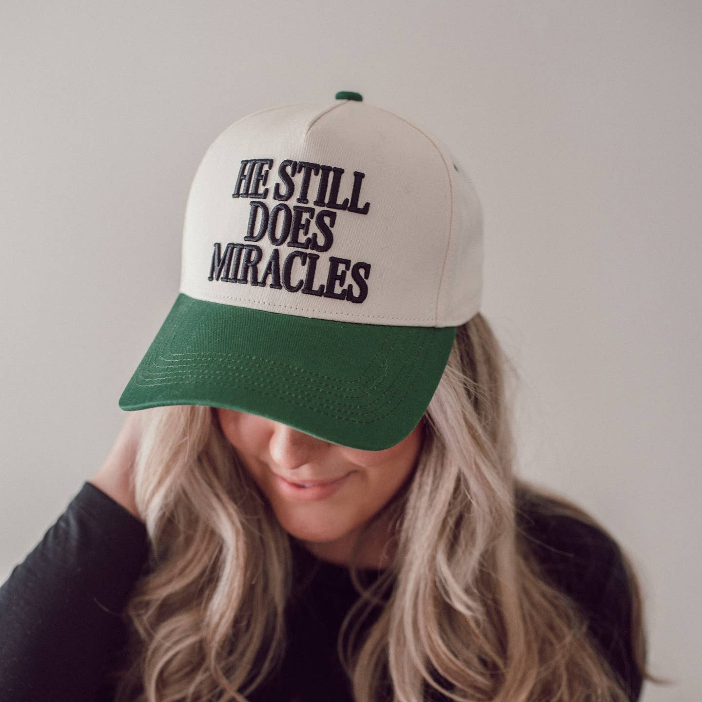 He Still Does Miracles Trucker Hat